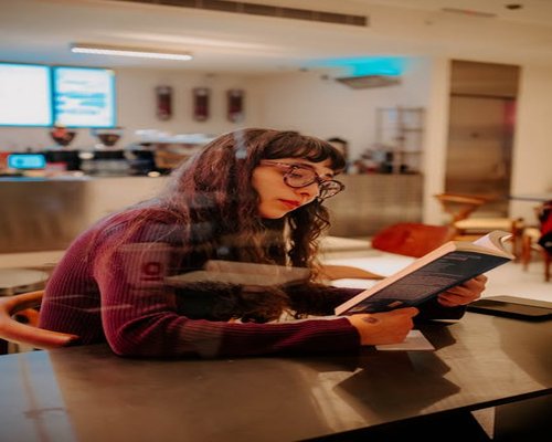 Woman relaxing and reading a book in a peaceful environment